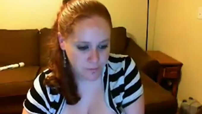 Chubby Redhead Showing Off Her Big Tits On Webcam