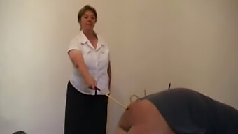 Mature Woman Uses A Cane On A Man